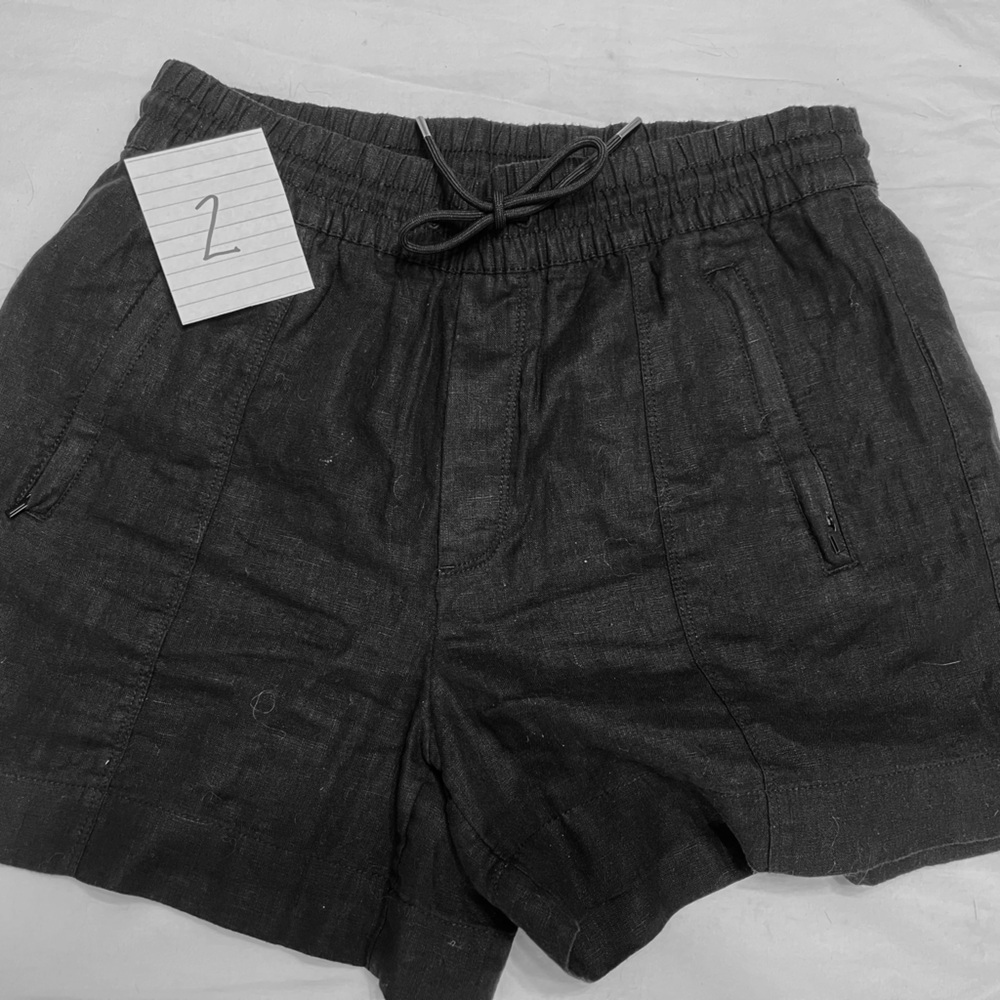 Athleta linen shorts size extra small. Black linen with two pockets drawstring.